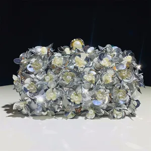 Stunning silver sequin floral evening clutch bag with pearl accents for women parties.