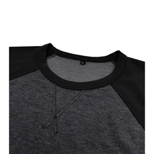 Détail sweat-shirt manches longues homme, col rond et design colorblock raglan.