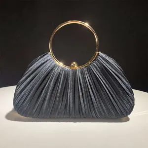 Elegant pleated satin evening clutch bag with gold round metal handle for party and wedding.