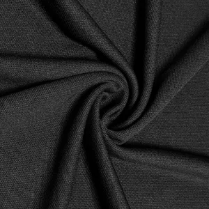 Close up fabric texture detail of black textile material showing soft fine knit weave pattern.
