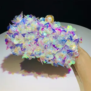 Close-up detail of the stunning iridescent sequin flower evening clutch bag with pearl clasp.