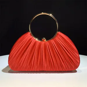 Red satin pleated evening clutch bag with elegant gold round metal handle for women party