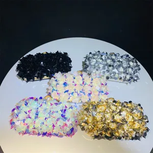 Stunning evening clutch bags with detailed sequins and floral patterns, ideal for events.