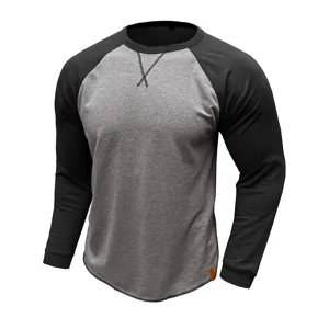 Gros plan du sweat-shirt à manches longues pour homme, design colorblock raglan et ourlet incurvé.
