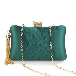 Elegant dark green satin evening clutch bag featuring gold chain, tassel and rhinestone clasp.