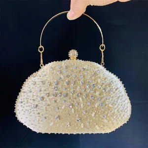 Sprankelende strass parel avondtas met rond metalen handvat voor bruiloft feest en gal.