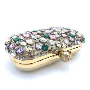 Detailed view of handmade crystal rhinestone evening clutch bag with luxury gold frame.