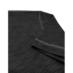 Close-up detail of men's dark grey cotton t-shirt shoulder and sleeve stitching.