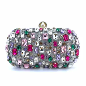 Elegant crystal evening clutch bag with colorful rhinestones and pearl clasp for women.