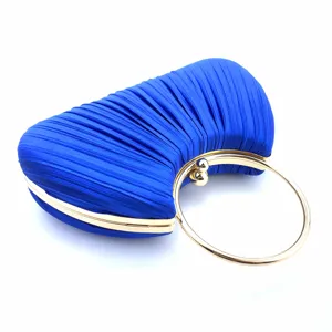 Royal blue satin pleated evening clutch bag detail showcasing golden round metal ring handle.