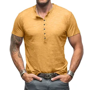 Detailed view of men solid color short sleeve henley shirt, featuring front button placket.