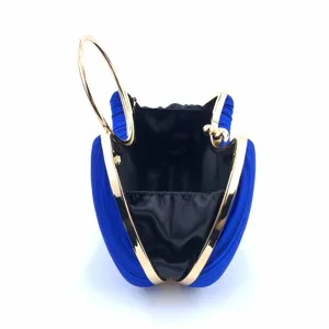 Blue satin evening clutch bag detail, elegant pleated design with gold metal ring handle.