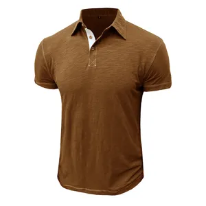 Detailed view of men's brown short sleeve polo shirt with classic collar and contrast buttons.