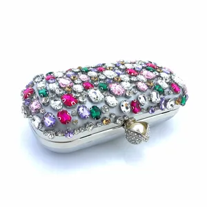 Exquisite rhinestone evening clutch detail showing colorful crystal gems and pearl clasp.