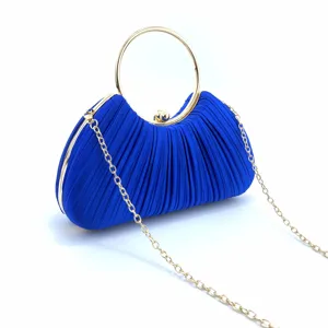 Royal blue pleated evening clutch with gold round ring handle and chain strap for parties.