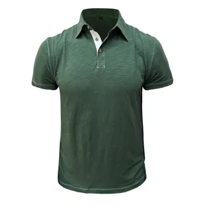 Dark green short sleeve polo shirt detail, classic lapel collar with contrast white placket.