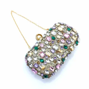 Elegant handmade rhinestone evening clutch bag with sparkling crystals and gold chain strap for women.