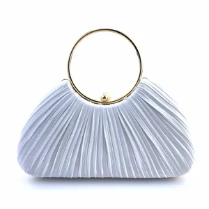 Elegant white satin pleated evening clutch bag detail showcasing the gold metal round handle.