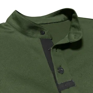 Men's dark green stand collar shirt detail close-up showing black buttons and placket design.