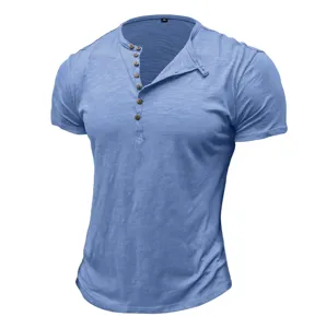 Detail view of the blue men's muscle fit Henley short sleeve t-shirt with button placket.
