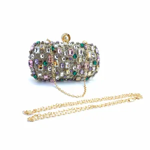 Close-up of rhinestone evening clutch bag showcasing crystal details and metallic chain strap.