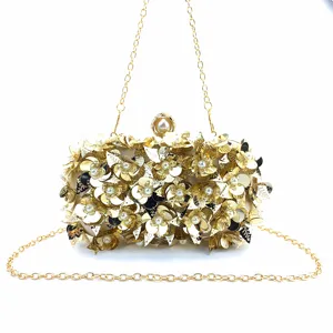 Elegant gold evening clutch bag with sparkling sequin flower appliques and pearl details.