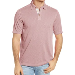 Close-up detail of the pink men's cotton polo shirt collar and button placket design.