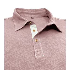 Detail shot of men's cotton polo shirt collar and placket, casual business style.