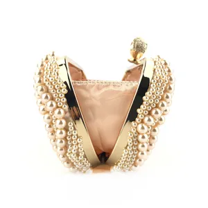 Handmade pearl evening clutch bag with gold metal frame, elegant wedding party purse.