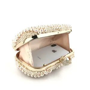 Handmade pearl evening clutch bag with gold metallic frame and rhinestone clasp for women
