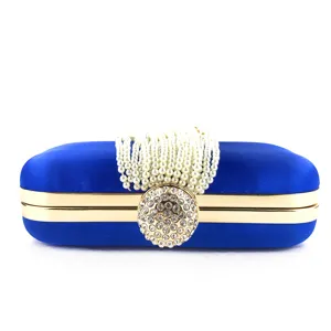 Royal blue satin evening clutch bag with pearl handle and rhinestone clasp, elegant party purse.
