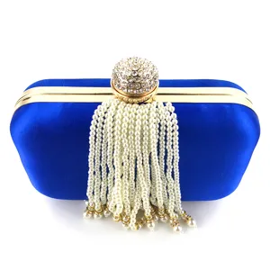 Blue satin evening clutch bag with crystal ball clasp and pearl tassel drop detail.