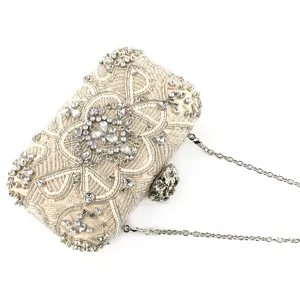 Exquisite handmade beaded evening clutch bag with sparkling rhinestones and metallic chain.