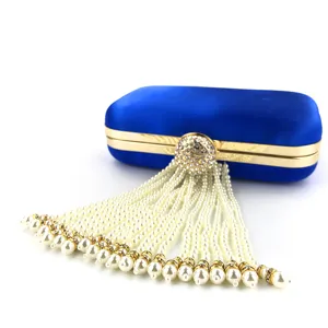 Elegant blue velvet evening clutch bag with stunning pearl tassel and gold frame for women.