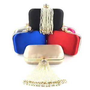 Elegant satin evening clutch bag with sparkling rhinestone clasp and gorgeous pearl beaded tassels.