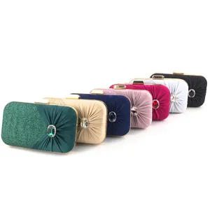 Rhinestone pleated evening clutch bag detail showing multi-color variant options and crystal lock.