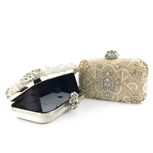 Beaded evening clutch bag detail showing exquisite rhinestone embroidery and spacious interior.