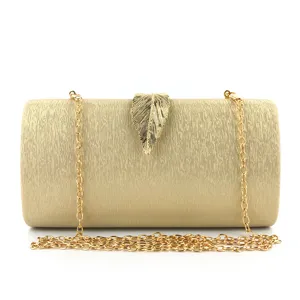 Elegant gold clutch bag with leaf clasp and metallic chain strap for evening parties.