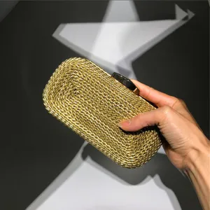 Elegant gold woven clutch bag for women, stylish metallic evening bag with secure clasp.