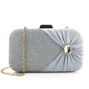 Elegant silver glitter evening clutch bag with pleated satin and crystal buckle for women.