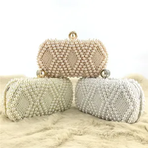 Handmade pearl evening clutch bag featuring elegant diamond beaded pattern for women party.