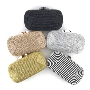 Detailed view of woven PU leather evening clutch bags in multiple colors with metallic clasps.