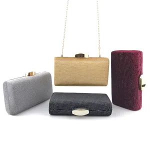 Elegant glitter velvet evening clutch bag with metallic clasp closure for formal party events.