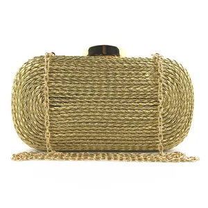 Gold woven clutch bag for women with metal chain strap and clasp. Elegant evening bag detail.