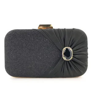 Elegant black evening clutch bag with sparkling glitter and dazzling rhinestone ornament detail.