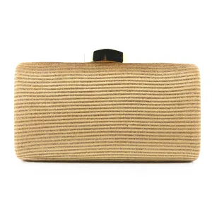 Gold glitter clutch bag detail, elegant evening purse metallic clasp close-up view.