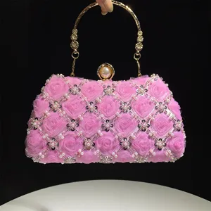 Elegant pink floral beaded evening bag with pearl clasp and metal handle for women parties.