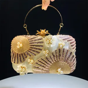 Elegant beaded evening clutch bag with sequins pearls and metal handle for weddings parties.