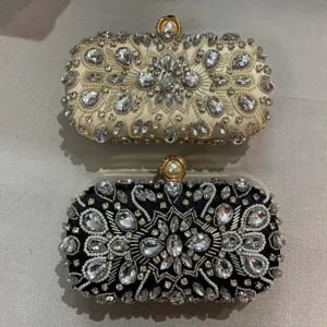 Elegant rhinestone evening clutch bag with pearl clasp, perfect for parties and weddings.