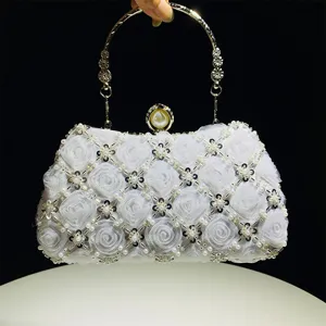 Elegant white beaded evening clutch bag with mesh floral design and metal ring handle.